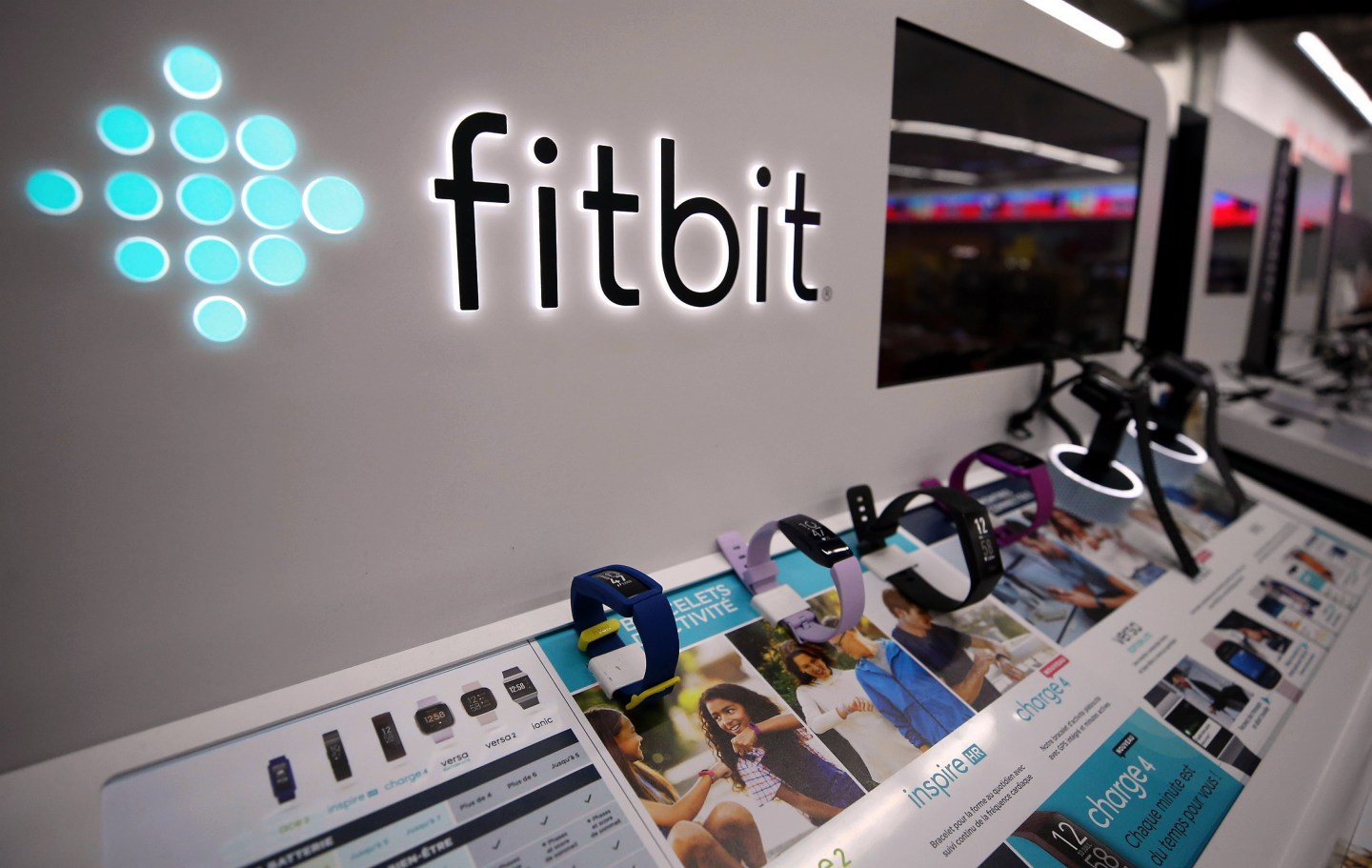 Logo of Google is displayed on a smartphone as logo of Fitbit is seen in Brussels, Belgium on August 04, 2020.
