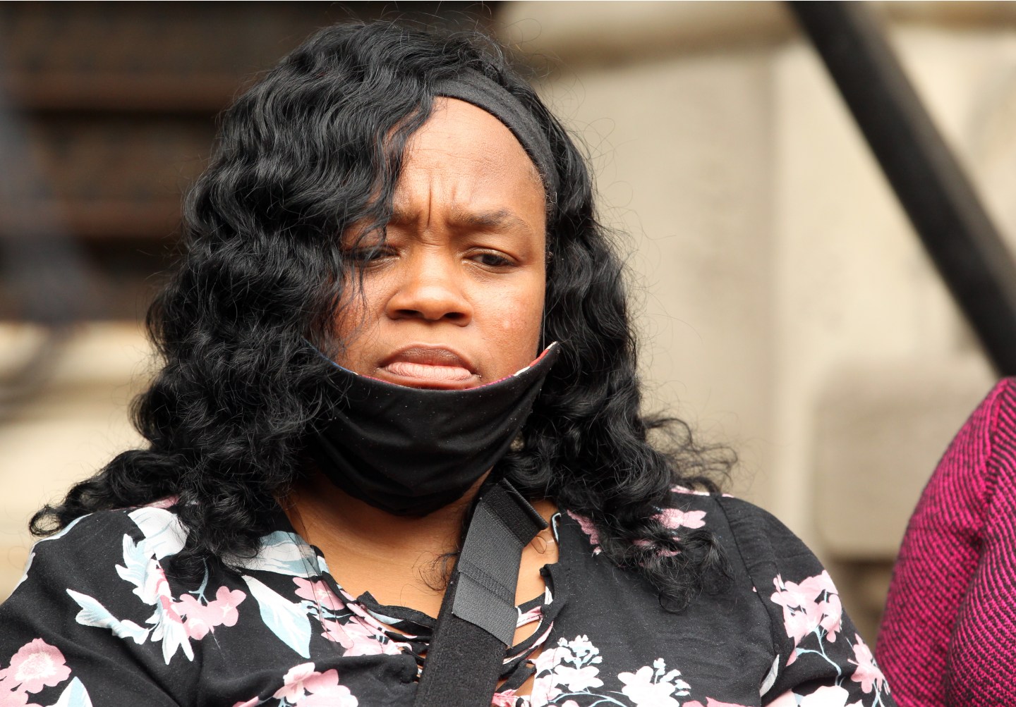 OUISVILLE, KY - AUGUST 13: Breonna Taylor's mother Tamika Palmer listens during a press conference over the speed of the investigation of her daughter's death as attorney Benjamin Crump and co-counsel Lonita Baker addresses the media outside Louisville City Hall on August 13, 2020 in Louisville, Kentucky.The attorneys and family are upset with the lack of action by city officials during the 150 days since Breonna Taylor was fatally shot by Louisville Metro Police officers. (Photo by John Sommers II/Getty Images)