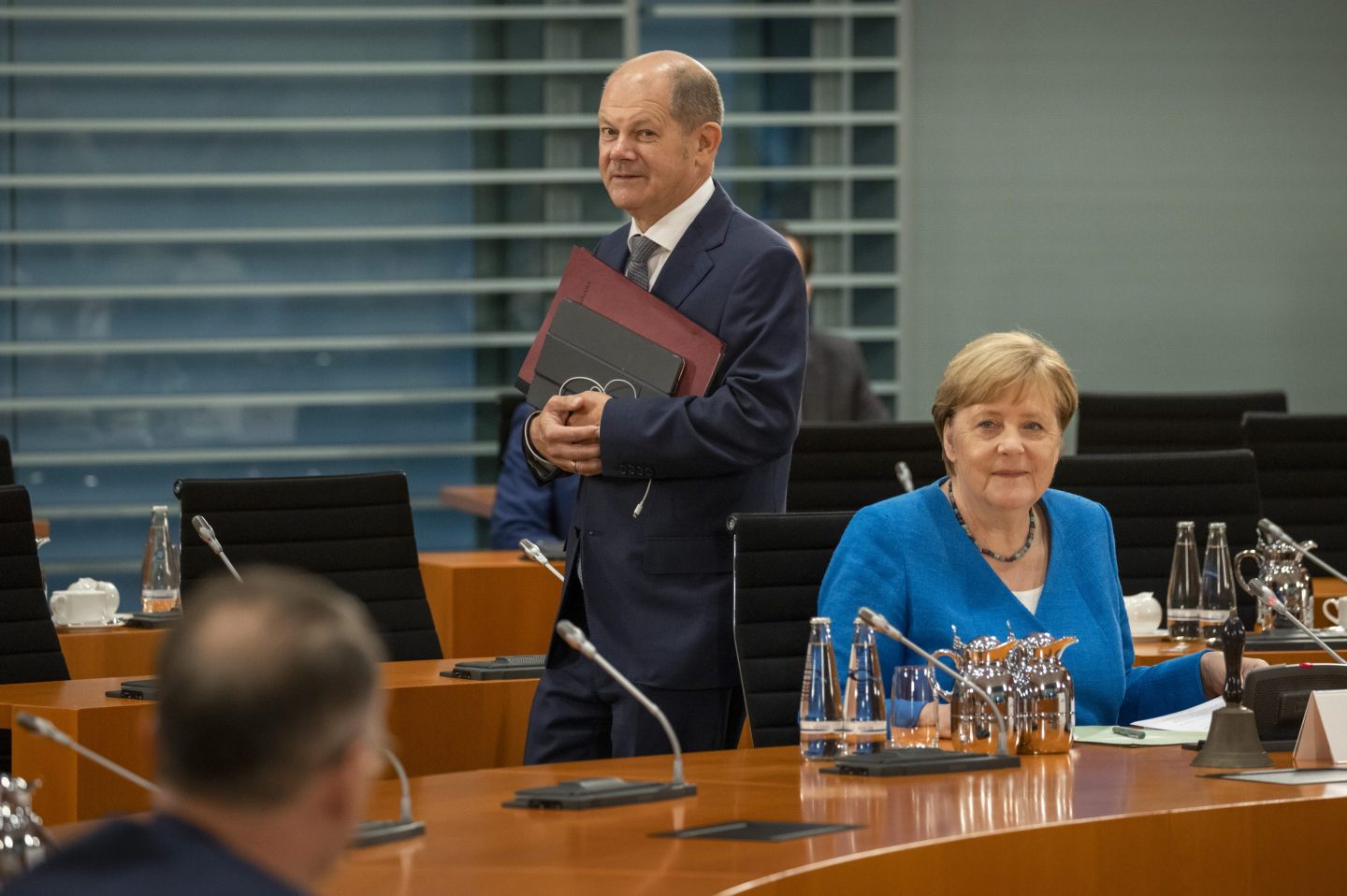 German Chancellor Angela Merkel (L) and German Finance Minister Olaf Scholz (R) arrive for the weekly cabinet meeting at the chancellery (Bundeskanzleramt) on August 26, 2020 in Berlin, Germany.