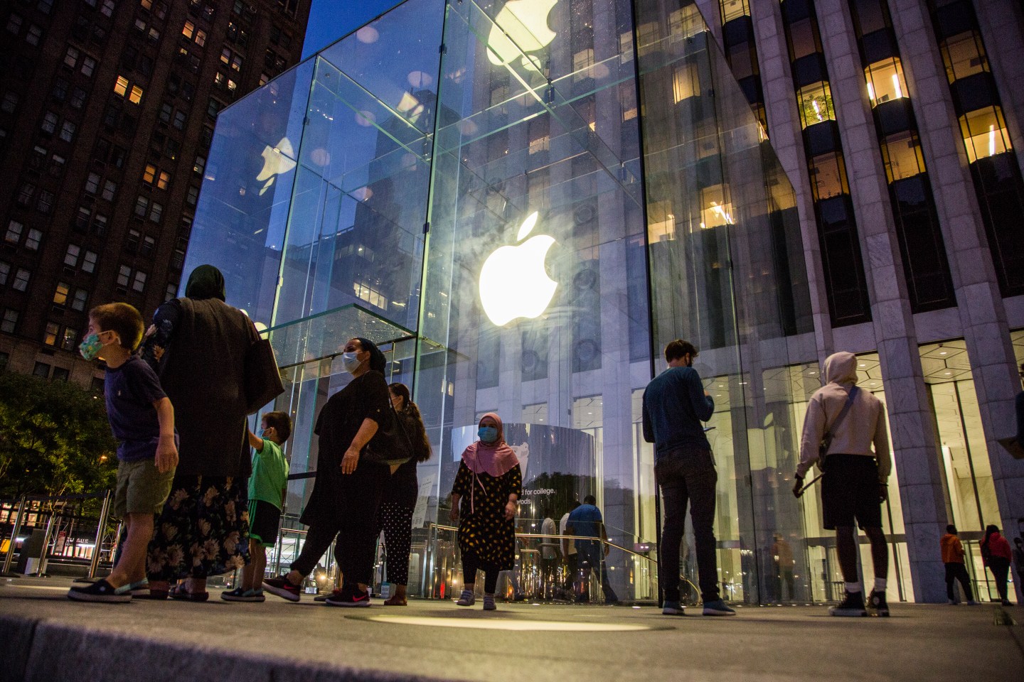 People line up outside the Apple store on Fifth Avenue on August 19, 2020 in New York City. Tech giant Apple has become the first American company to boast a $2 trillion market value, after just two years becoming the first to reach $1 trillion.