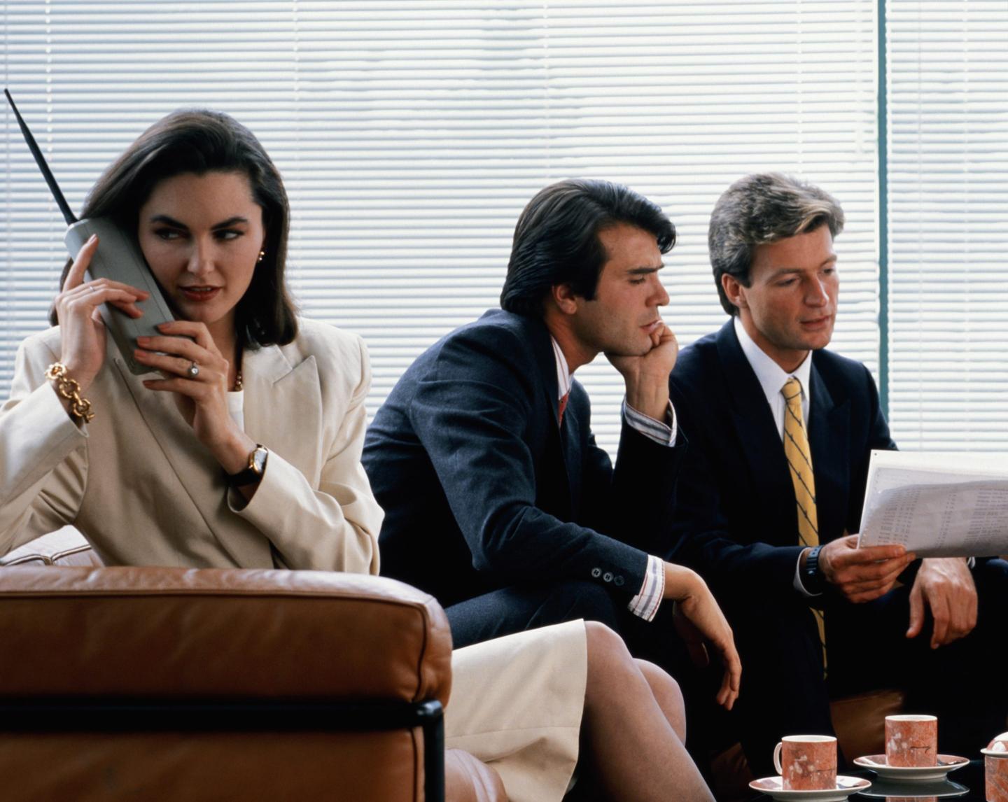 woman using 1980s cellphone