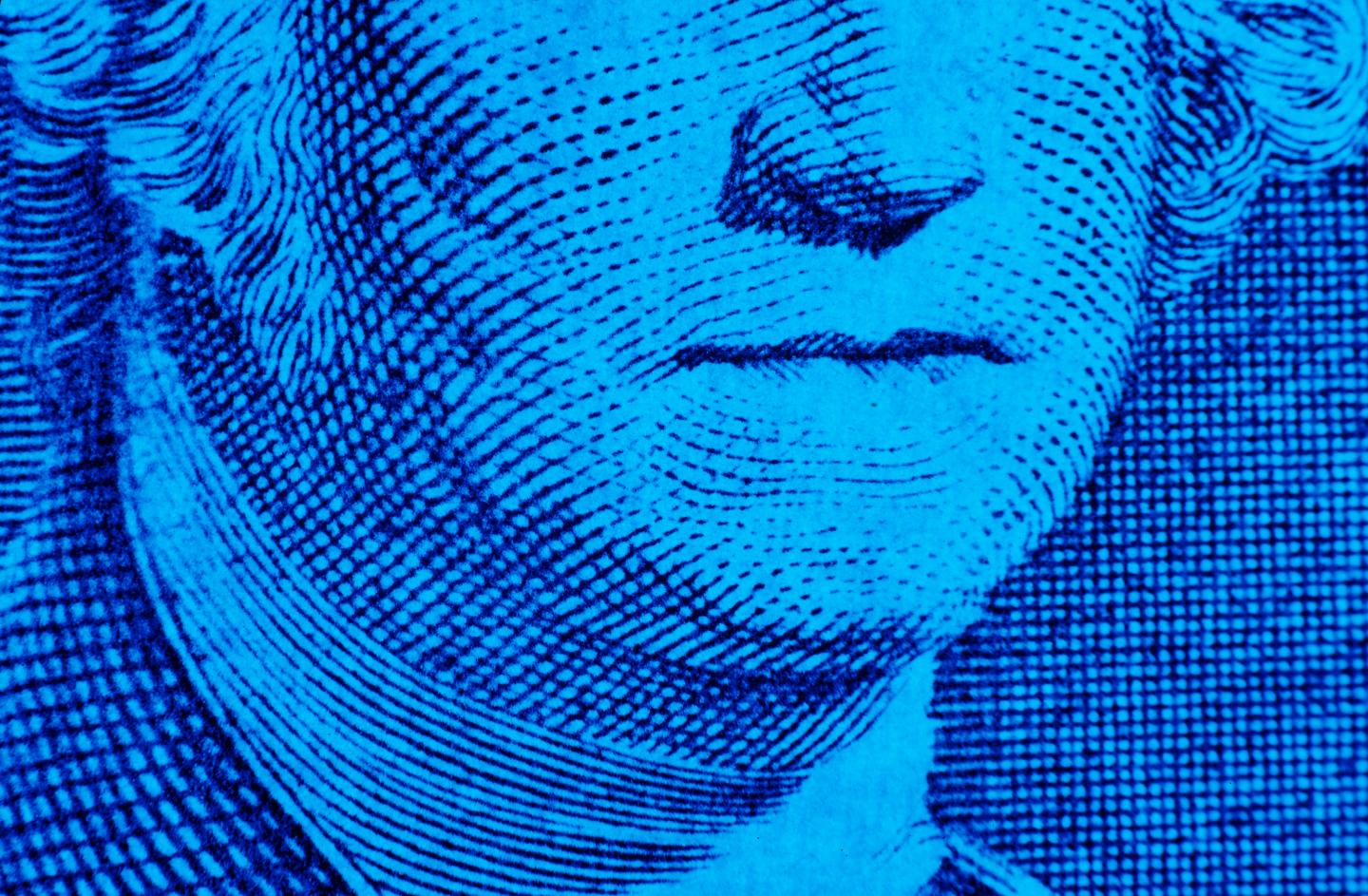 George Washington's mouth on a dollar bill.
