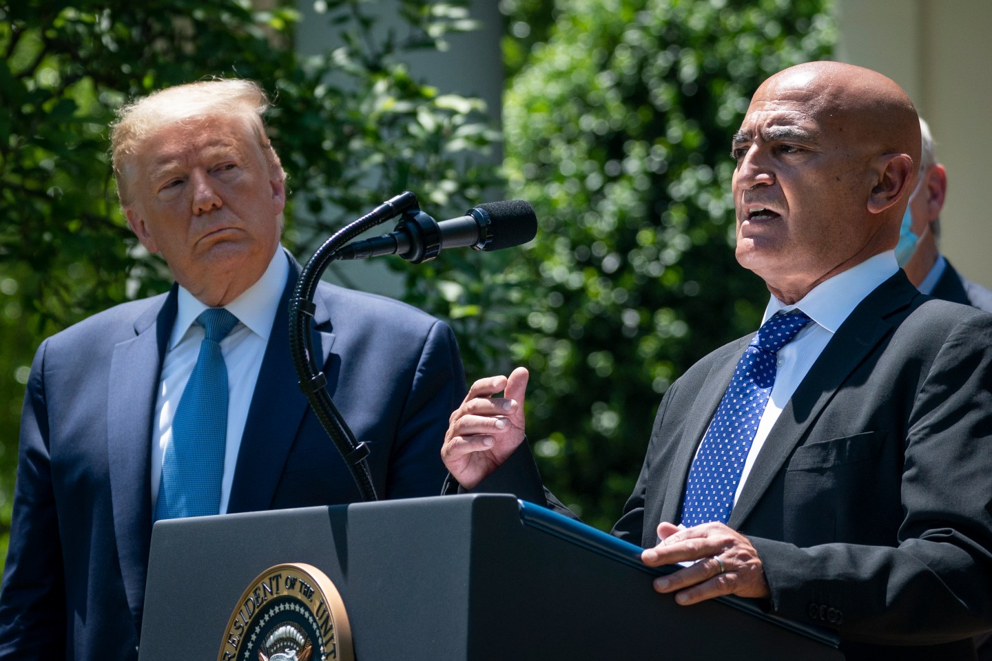 President Trump and Moncef Slaoui, the lead scientist on the "Operation Warp Speed" COVID-19 vaccine effort, at a White House press conference earlier this year. (Photo by Drew Angerer/Getty Images)