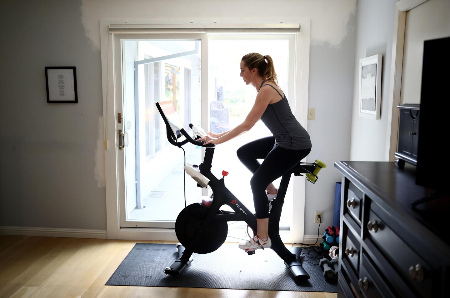 Peloton is lowering the price of its standard bike and releasing new exercise equipment
