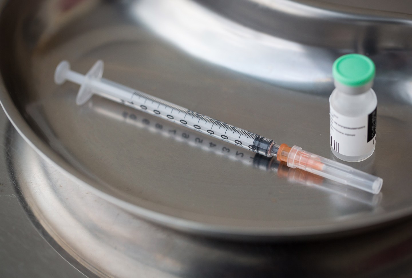 A syringe sits alongside a vial in a kidney dish in this arranged photograph taken at the Chaika Clinic in Moscow, Russia, on Monday, Aug. 10, 2020.