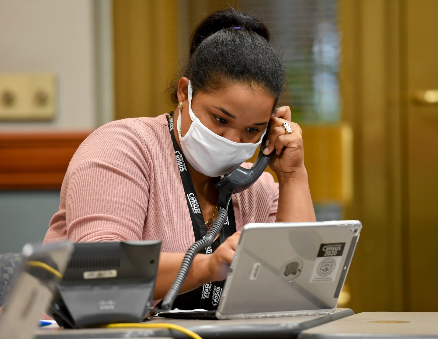 Census worker Anna Arroyo takes calls about the census. At City Hall in Reading, PA Tuesday afternoon September 1, 2020 where bilingual census workers were taking calls from the public about providing their information for the 2020 census.
