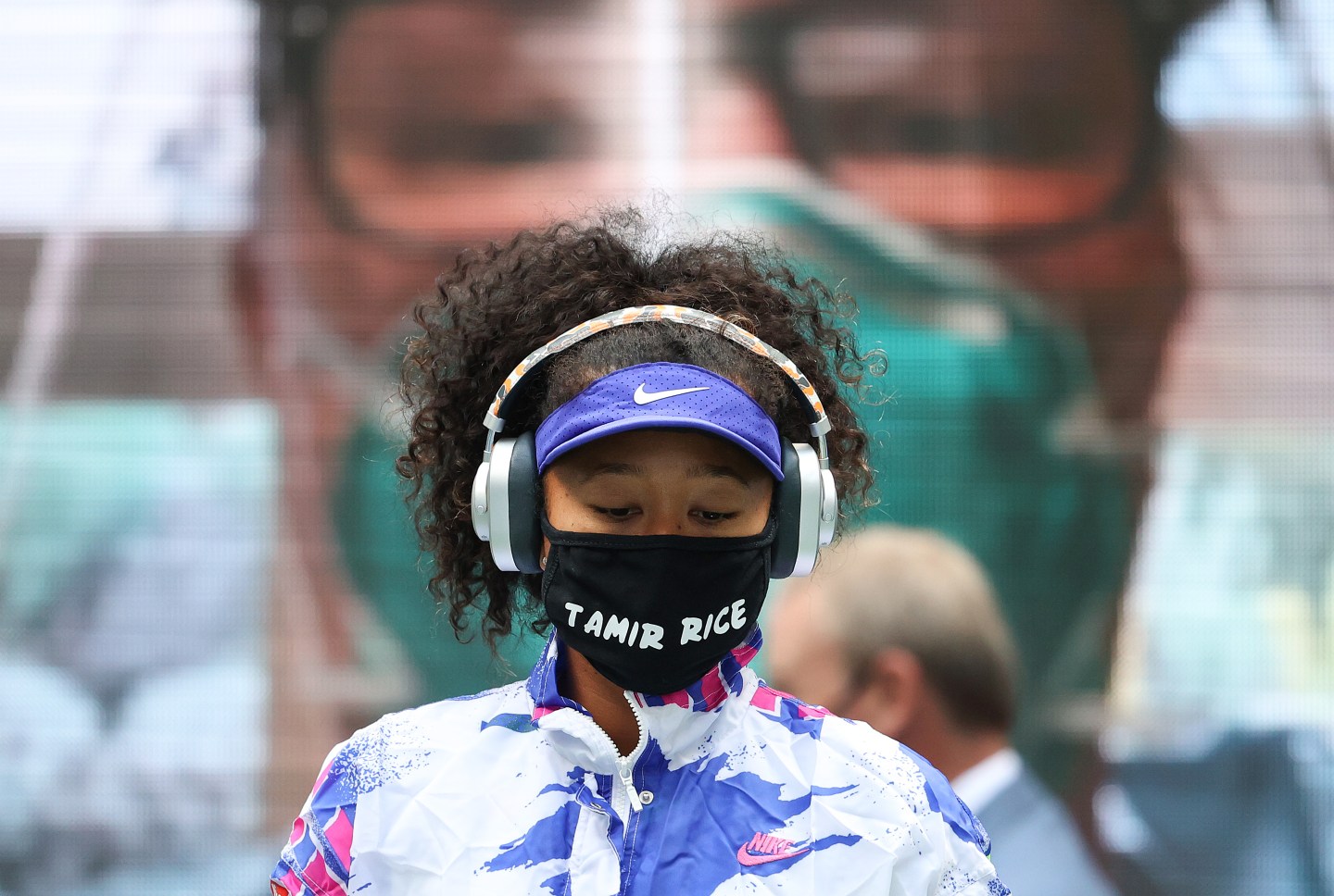 Naomi Osaka of Japan walks on court in front of virtual fans before her Women's Singles final match against Victoria Azarenka of Belarus. Al Bello/Getty Images