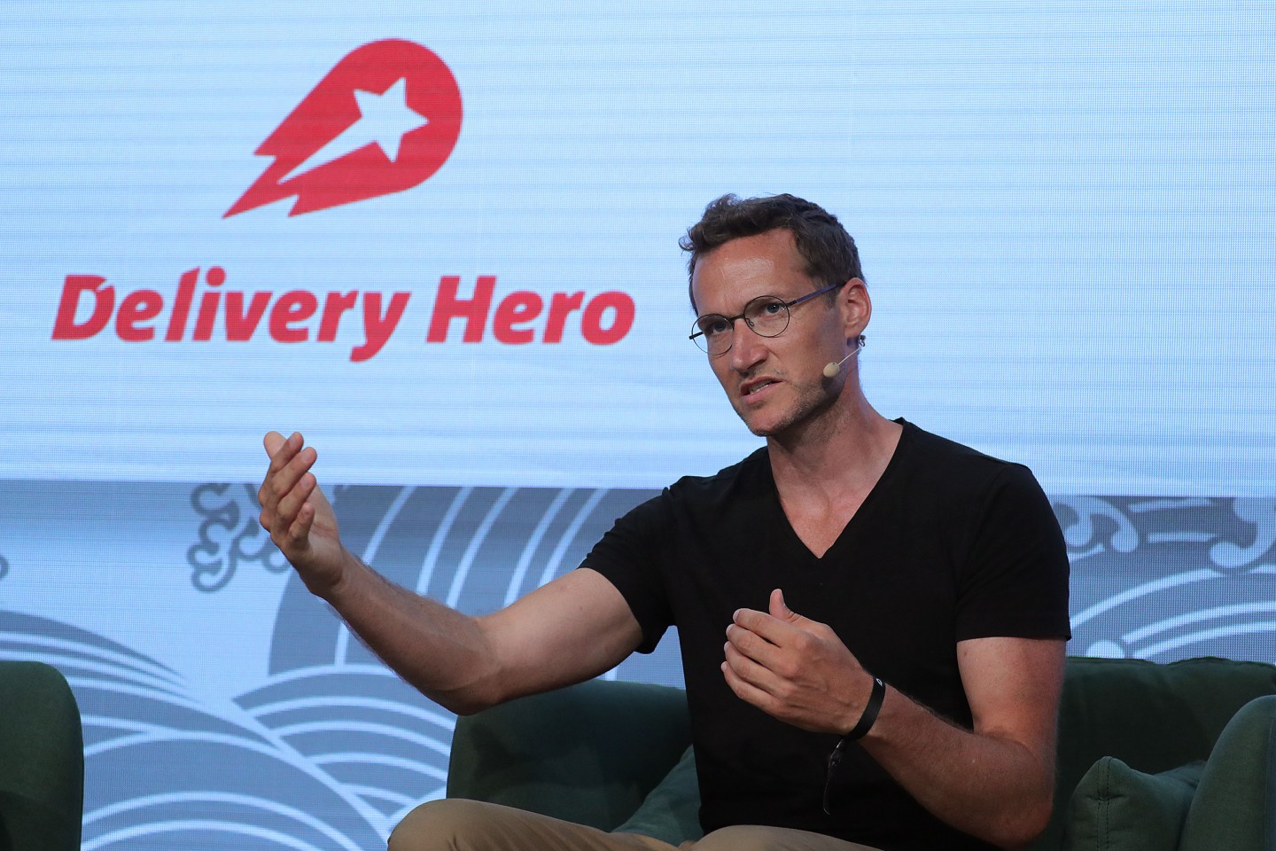 Niklas Oestberg, chief executive officer of Delivery Hero SE, gestures while speaking at the Noah Technology Conference in Berlin, Germany, on Thursday, June 13, 2019.