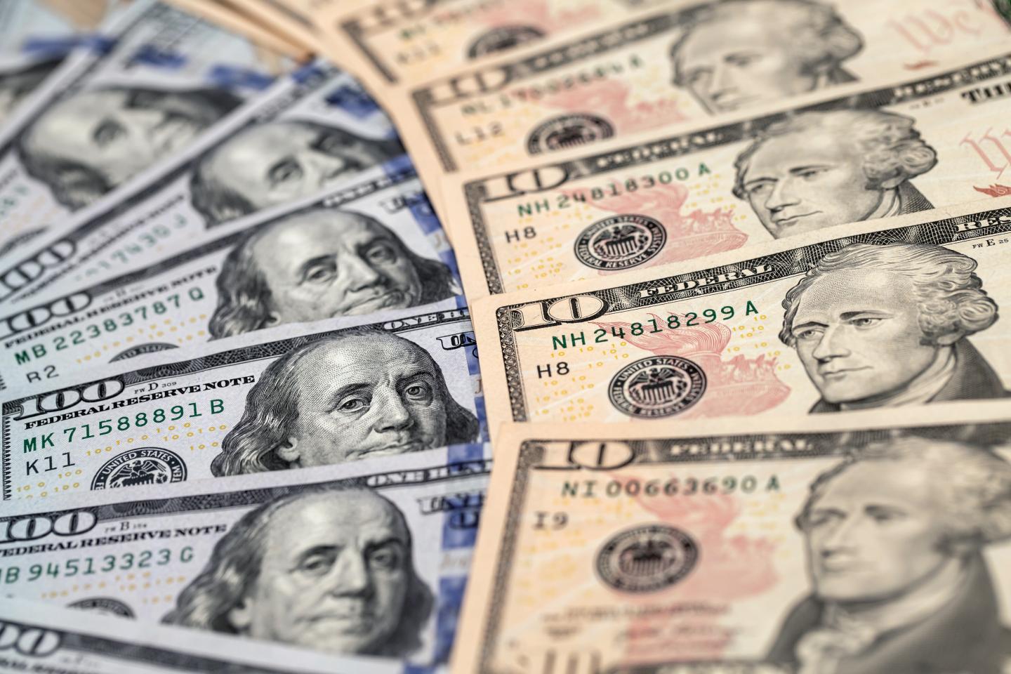 Dollar up, stocks down as curfews, COVID and underwhelming corporate results spook investors
