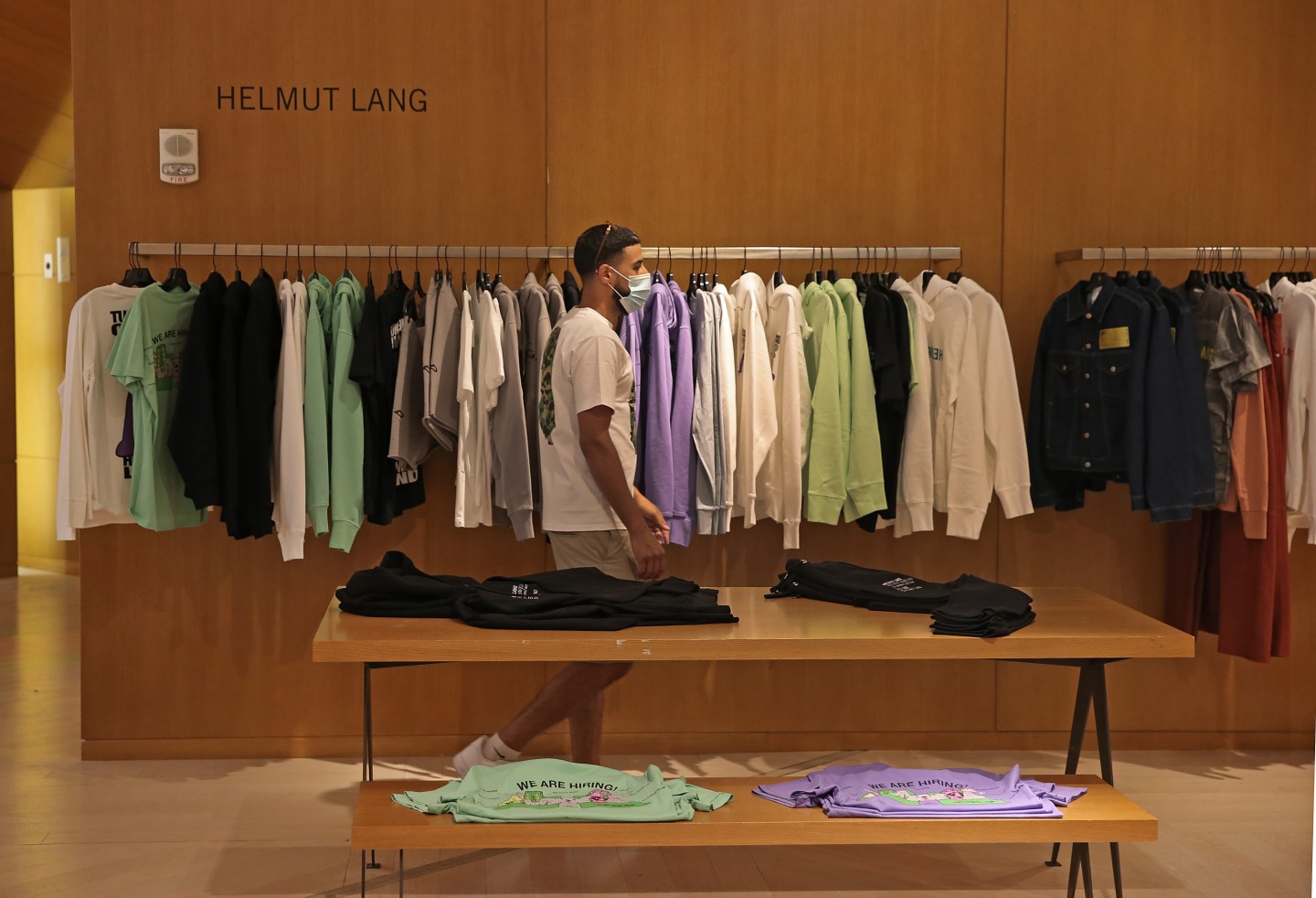 A customer shops in the new Saks Fifth Avenue in Boston on Aug. 15, 2020.