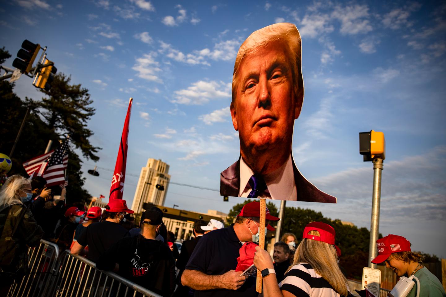 Supporters of President Donald Trump gather outside of Walter Reed National Military Medical Center after the President was admitted for treatment of COVID-19 on October 4, 2020 in Bethesda, Maryland.