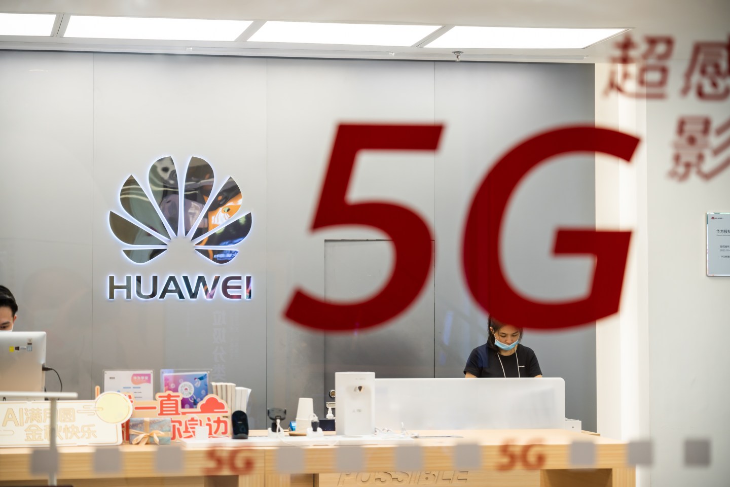 Chinese multinational technology company Huawei logo and 5G sign seen at a store.