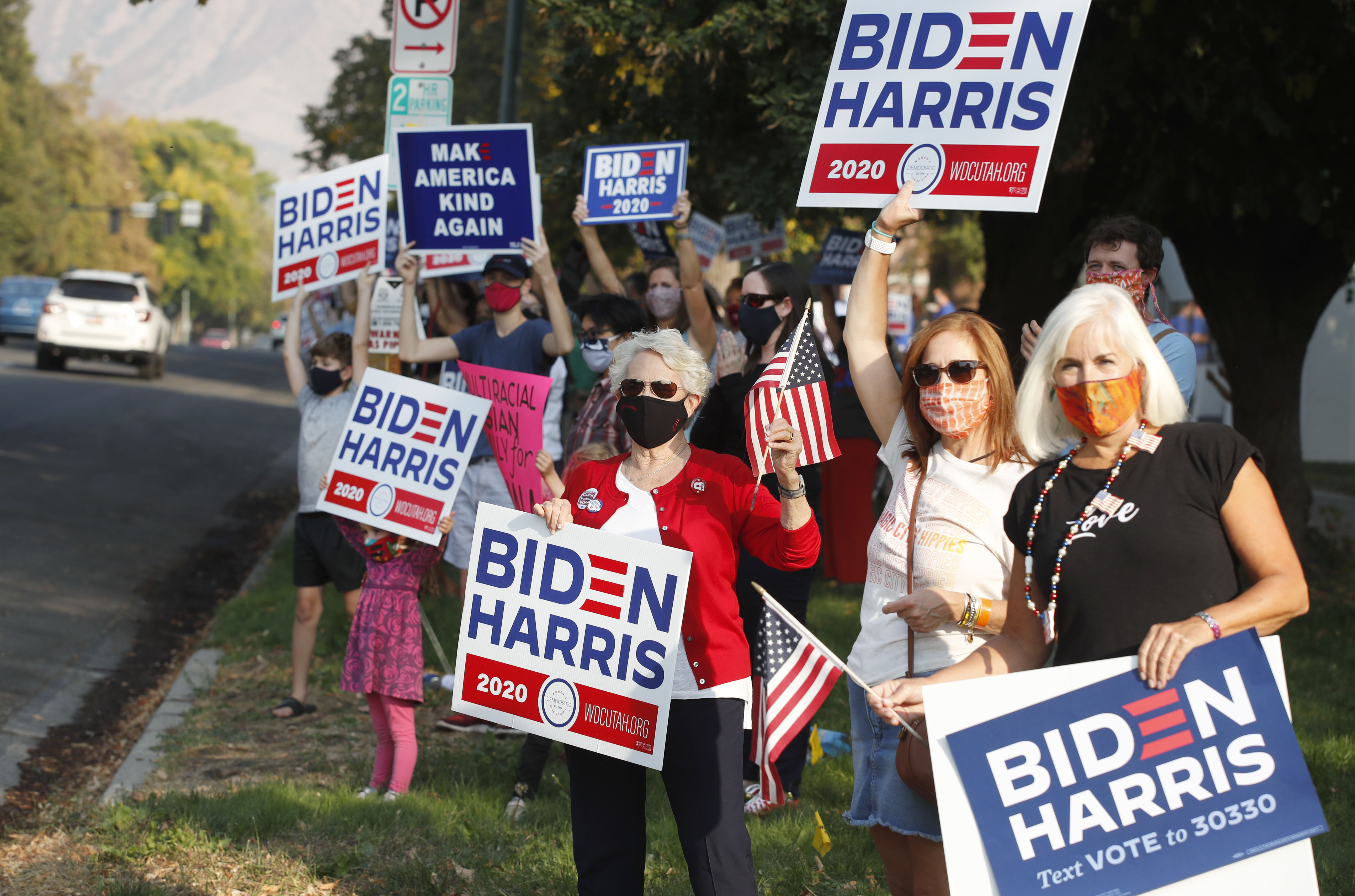 Supporters Democratic Presidential candidate and former US Vice President Joe Biden show their support before the vice presidential debate outside Kingsbury Hall at the University of Utah on October 7, 2020, in Salt Lake City, Utah. (Photo by GEORGE FREY / AFP) (Photo by GEORGE FREY/AFP via Getty Images)