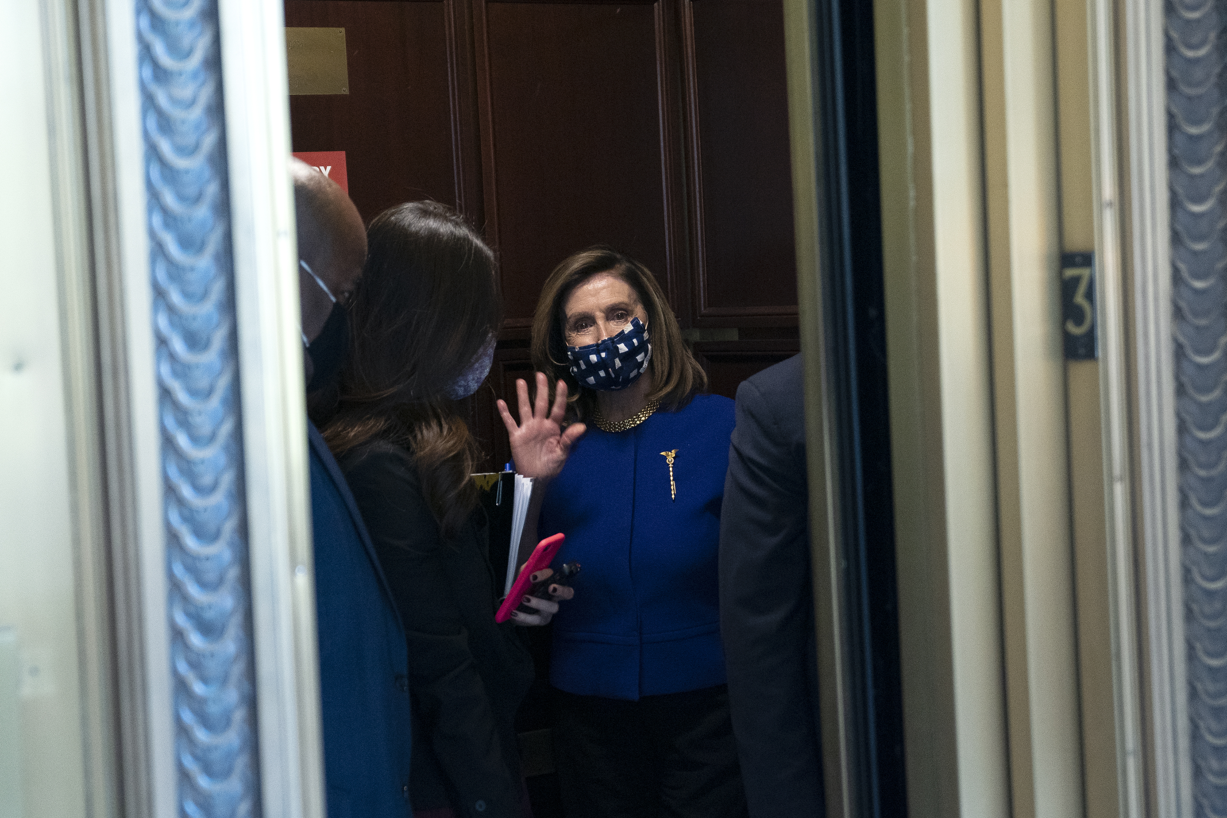 U.S. House Speaker Nancy Pelosi, a Democrat from California, right, waves as she departs following a television interview at the Russell Senate Office Building in Washington, D.C., U.S., on Friday, Oct. 9, 2020. 