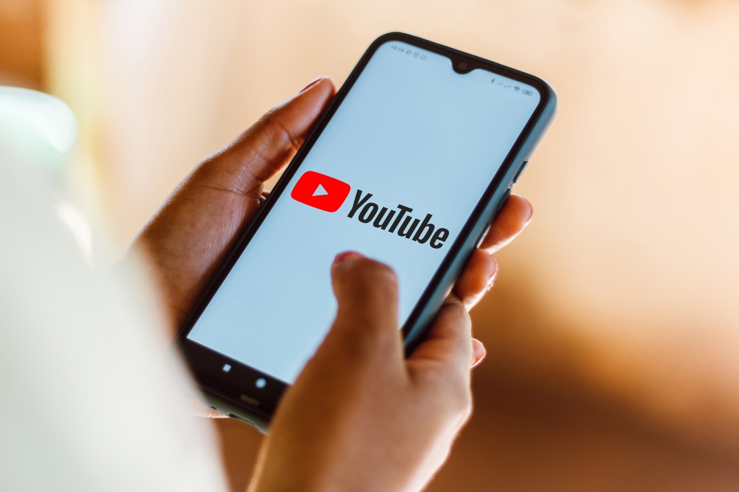 YouTube follows Facebook in banning QAnon, but with caveats
