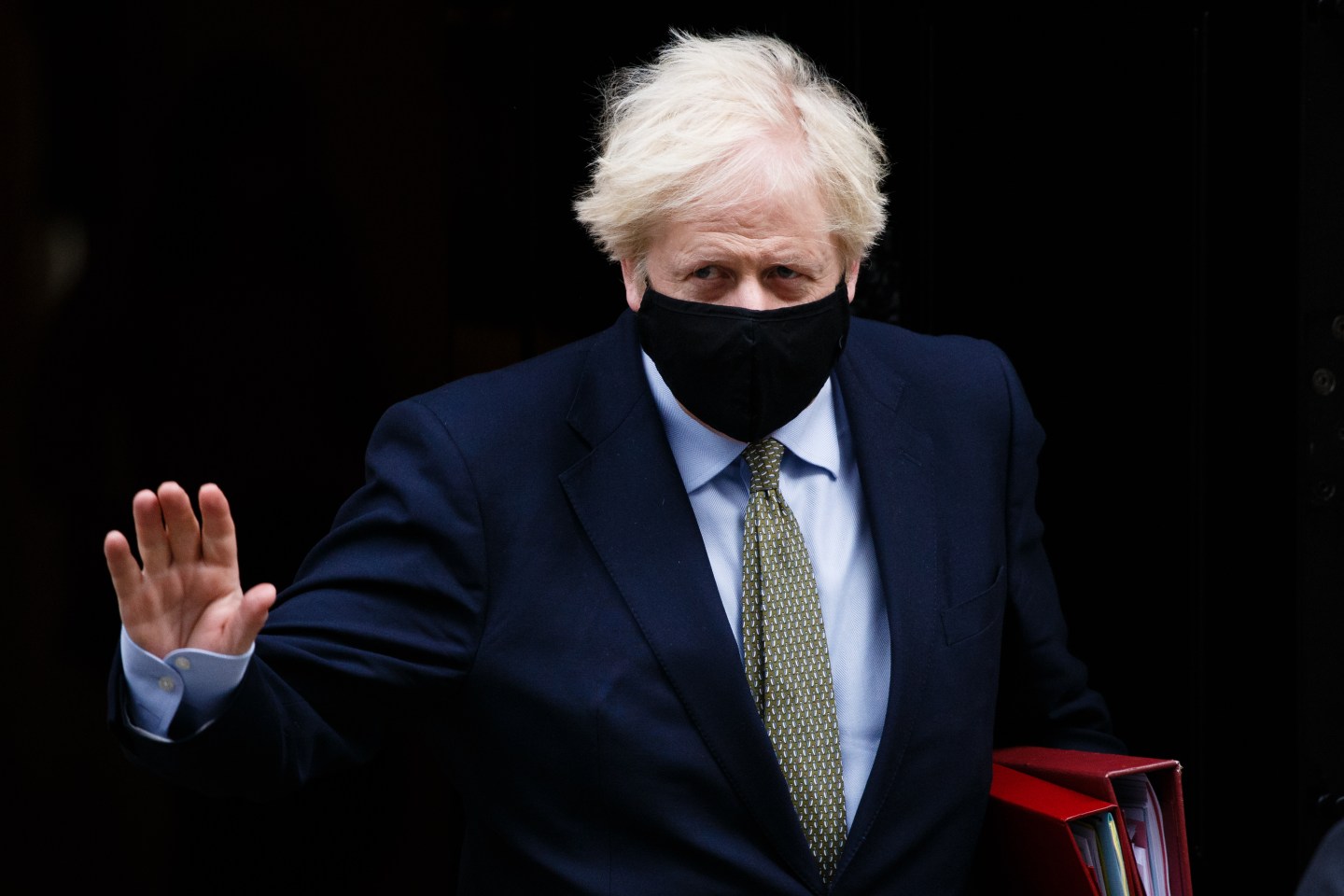 British Prime Minister Boris Johnson leaves 10 Downing Street wearing a face mask on his way to Prime Minister's Questions (PMQs) at the House of Commons in London, England, on October 14, 2020.