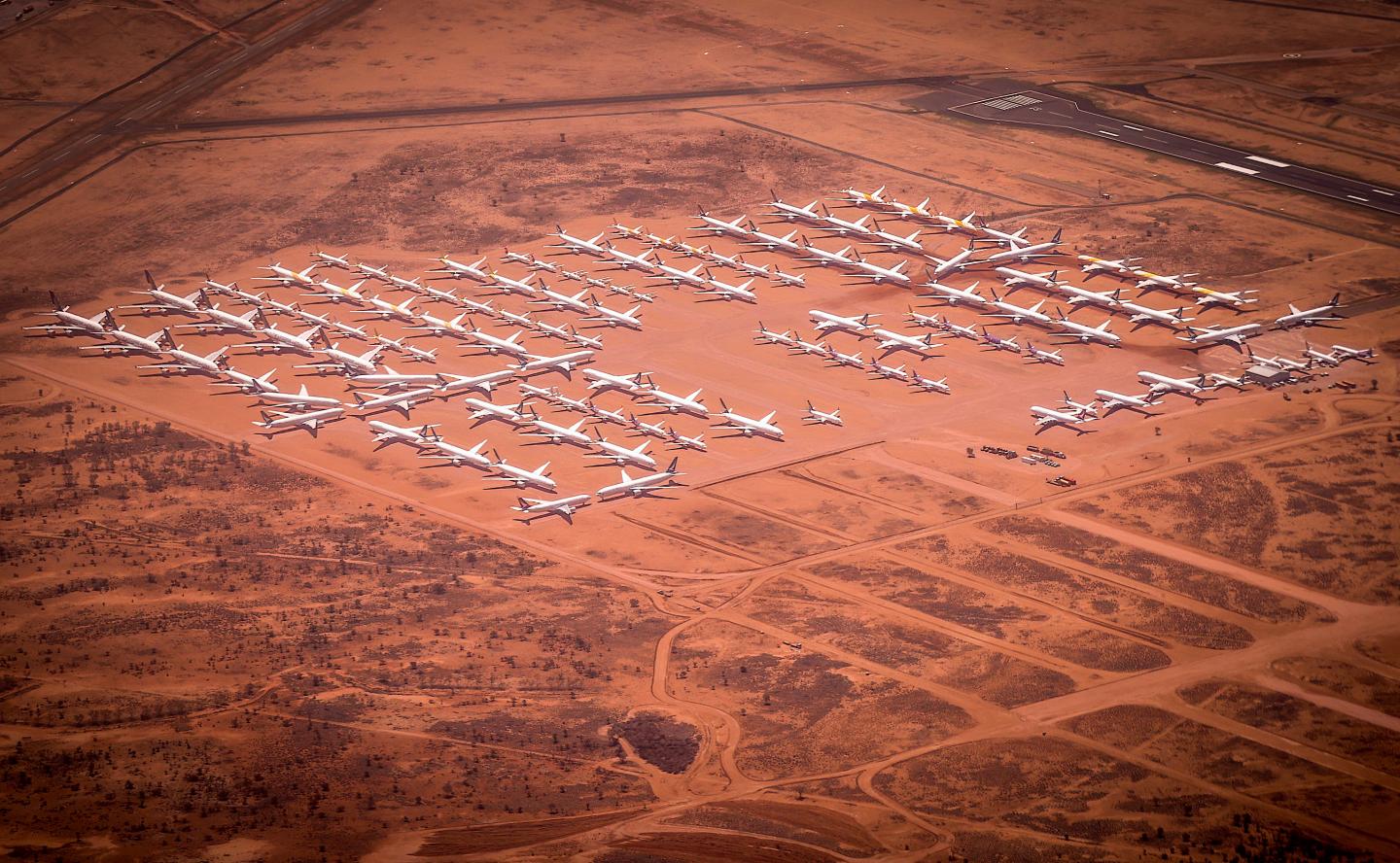 The world’s grounded jumbo jets sit in this desert parking lot in the middle of nowhere