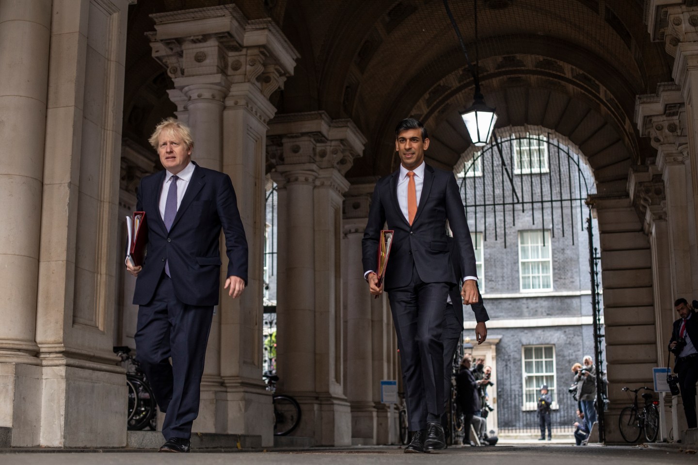 British Prime Minister Boris Johnson and Chancellor Rishi Sunak head to the weekly cabinet meeting at the British Foreign and Commonwealth Office on October 13, 2020 in London, England.