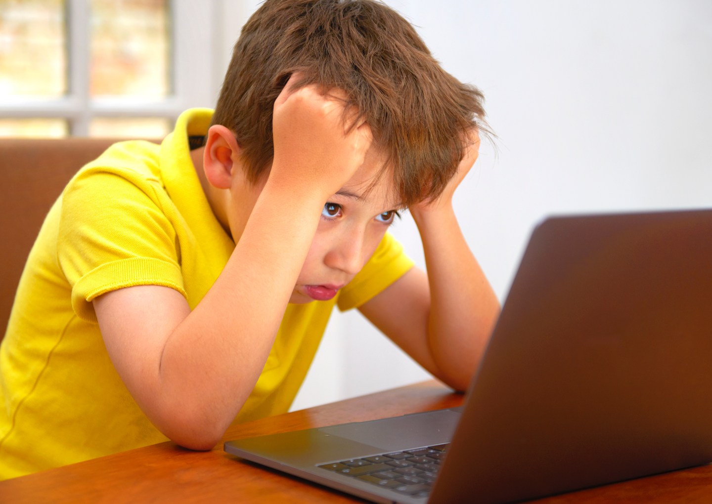 frustrated kid at computer