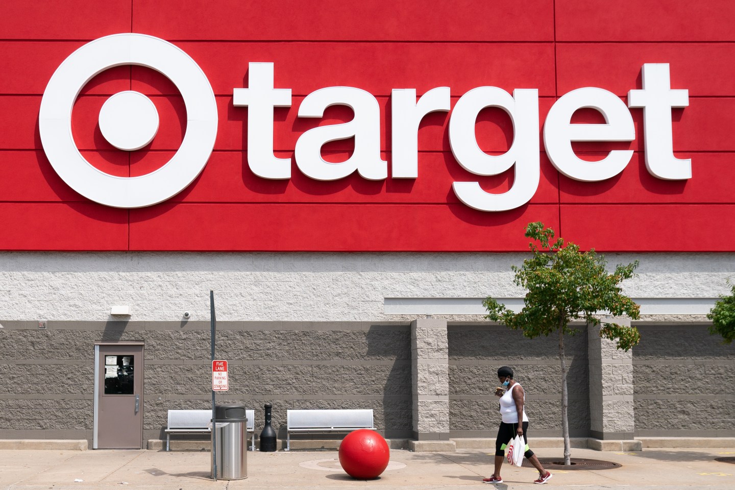 A shopper wearing a protective mask walks past a Target in Jersey City in August 2020.