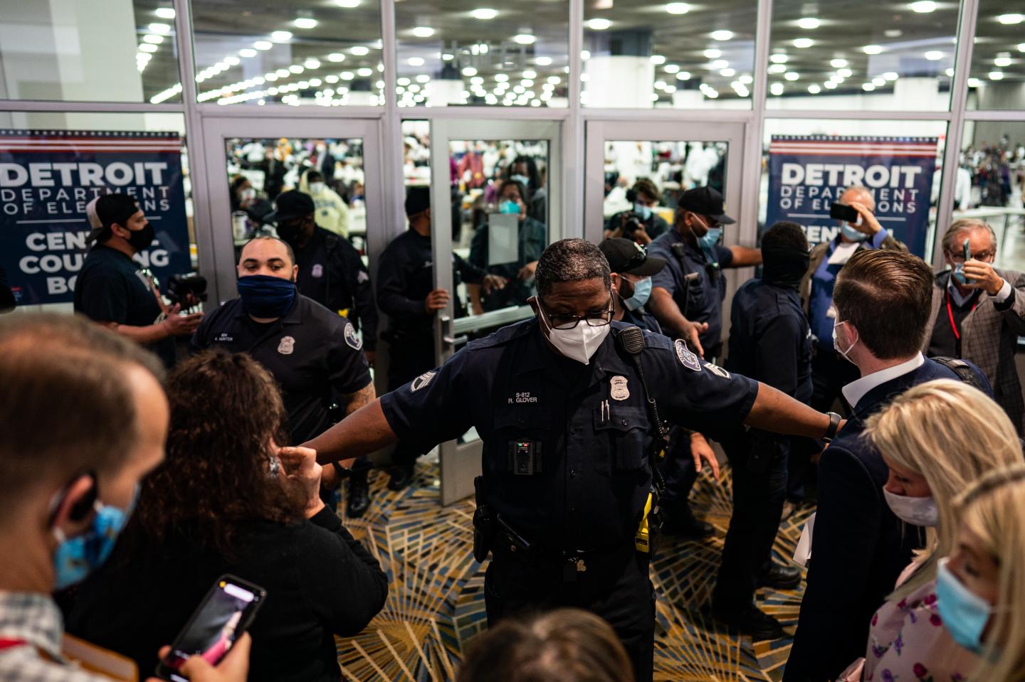 Election challengers demand to enter to observe the absentee ballots counting but were dined after the room reached capacity during the 2020 general election in Detroit, Michigan on Wednesday, Nov. 4, 2020.