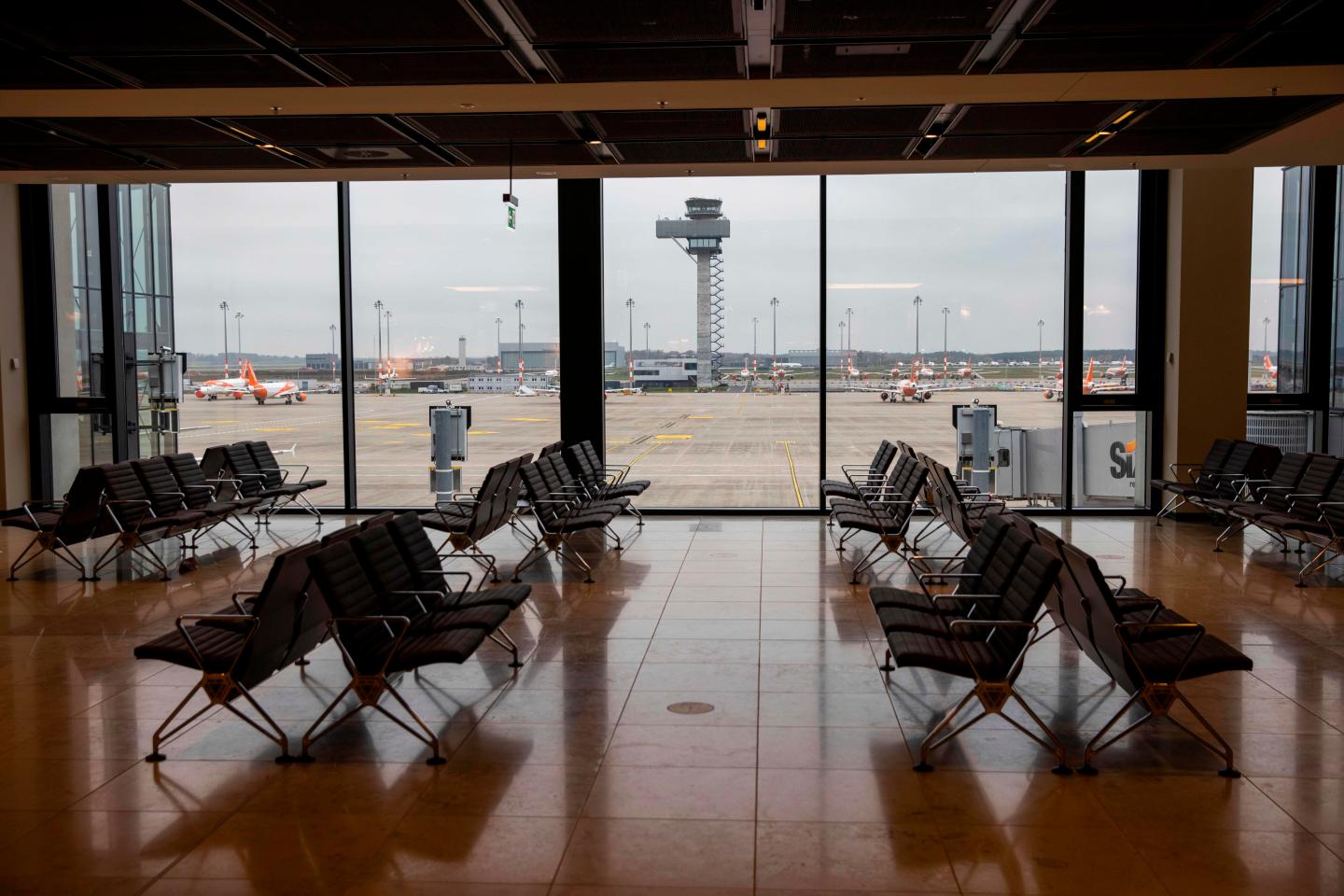 Empty seats are seen in terminal 1 at the "Berlin Brandenburg Airport Willy Brandt" in Schoenefeld, south-east of Berlin, on November 6, 2020. - British lowcost airline Easyjet announced on November 6, 2020, that it was reducing its flight capacity for the first quarter of 2021 to "at most 20%" of what it initially planned for this period, in reaction to the containment measures announced across Europe to combat the Covid-19 pandemic/