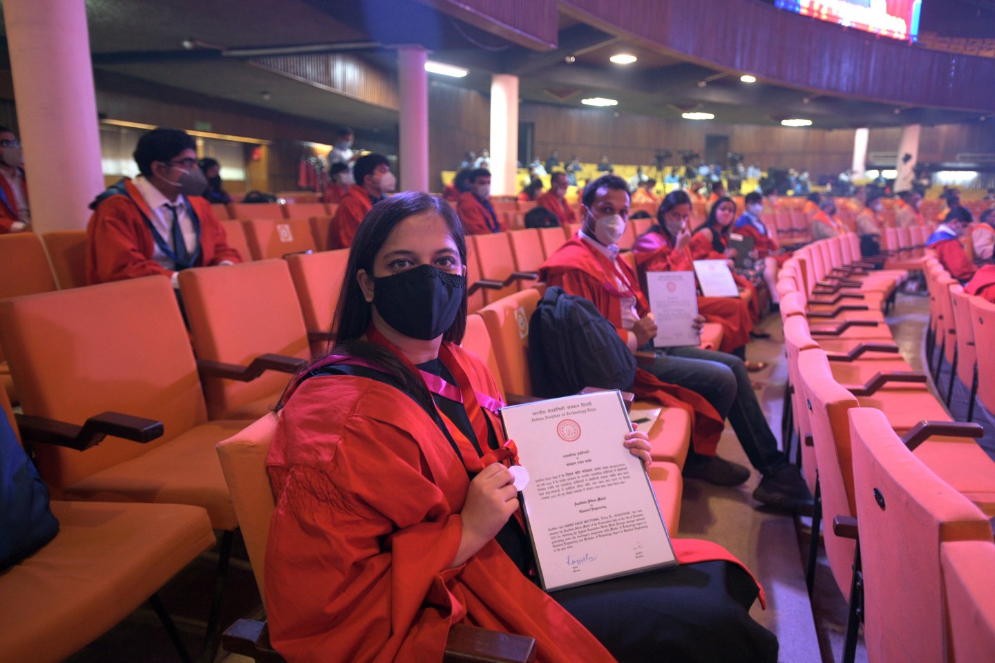 Graduating students show their degrees during the 51st Annual Convocation Ceremony at the Indian Institute of Technology (IIT) in New Delhi.