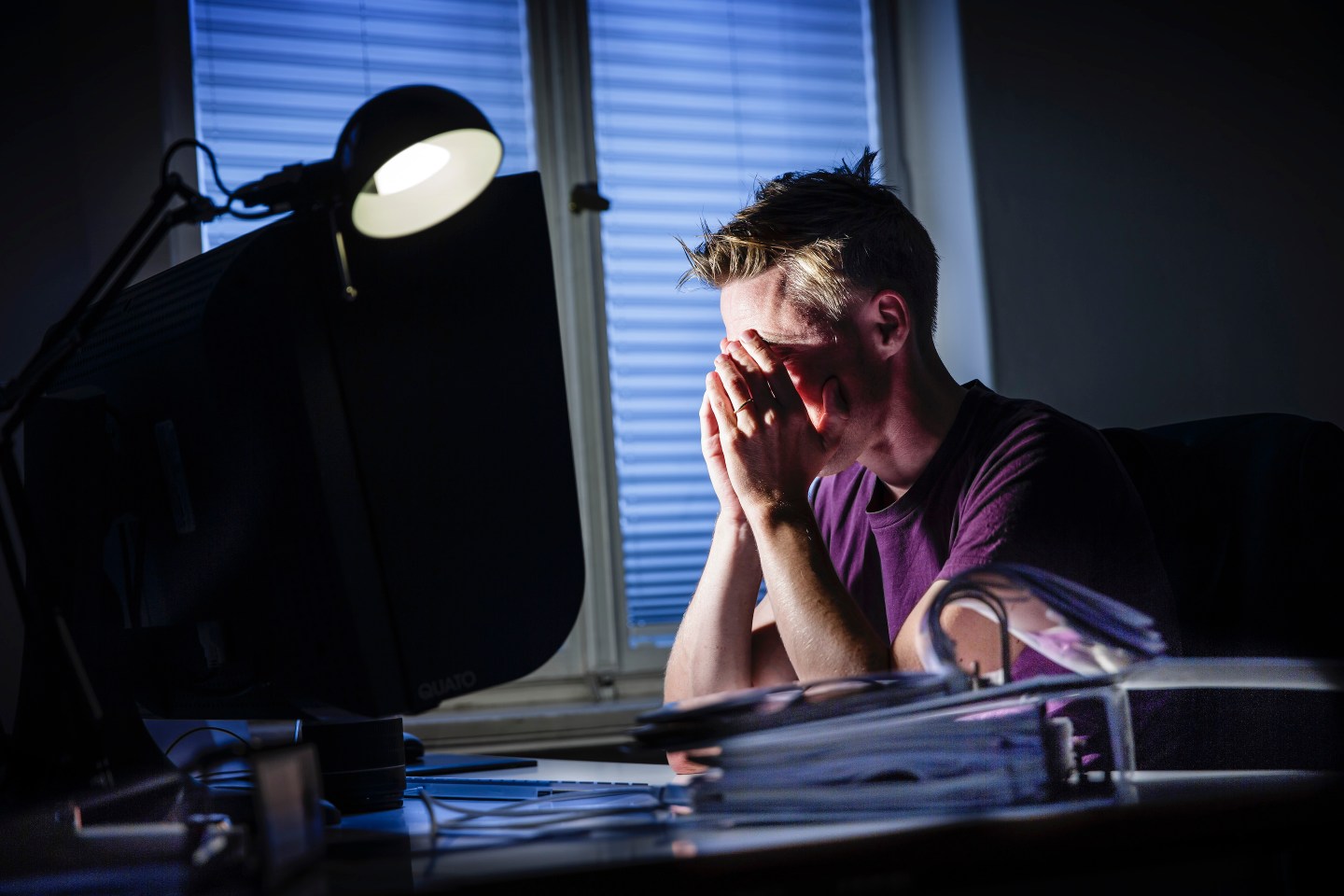 man at computer working late