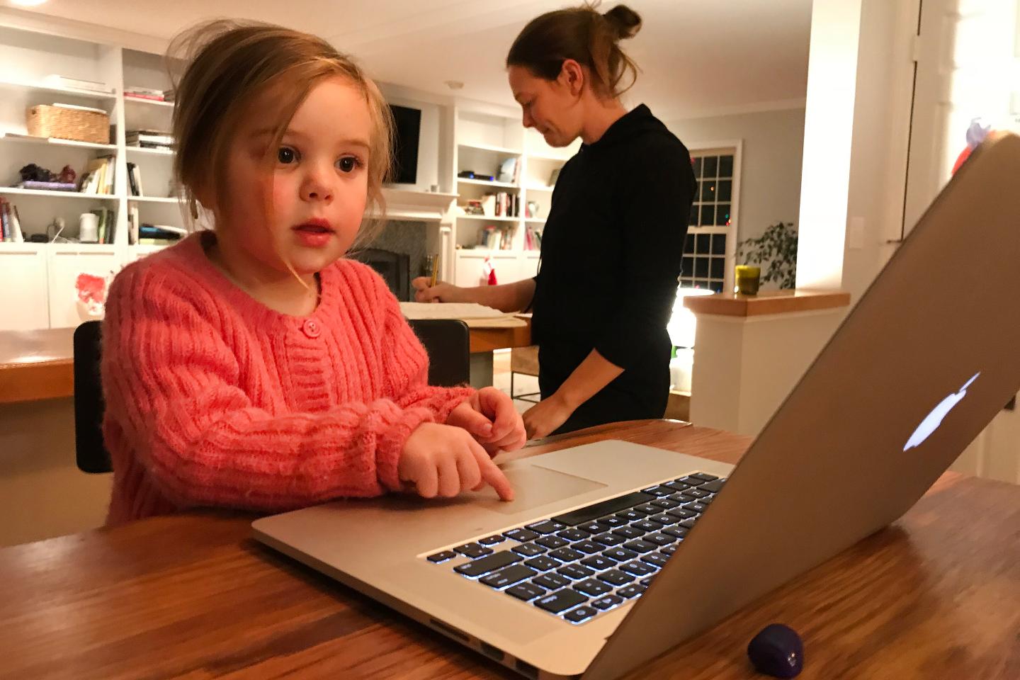 girl using macintosh laptop