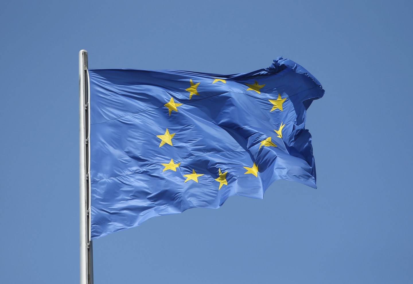 BERLIN, GERMANY - JULY 06: The flag of the European Union flies over the Reichstag the day after a majority of people voted "no" in the Greek referendum on July 6, 2015 in Berlin, Germany. Greeks voted in a strong majority against the reform plan proposed by the troika of the European Central Bank, the International Monetary Fund and the European Commission in a move that many fear will lead to a departure by Greece from the Eurozone. (Photo by Sean Gallup/Getty Images)