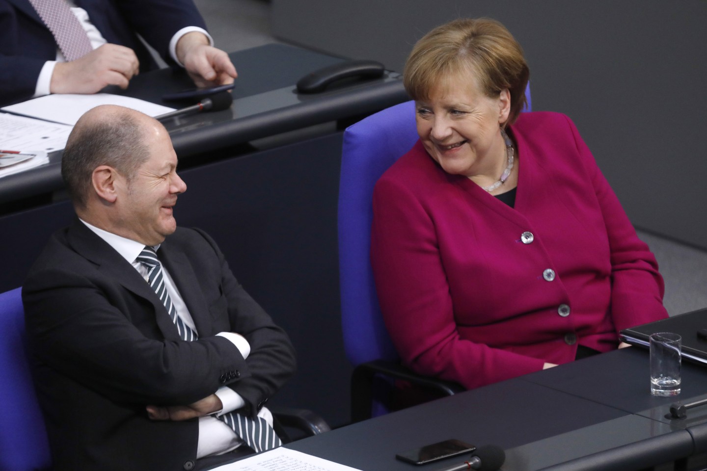 German Finance Minister Olaf Scholz with Chancellor Angela Merkel.