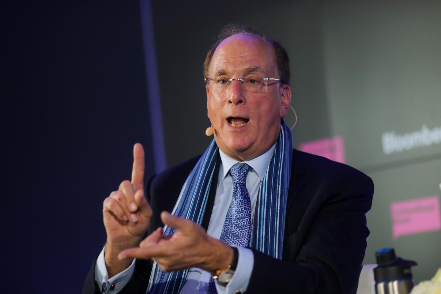 Larry Fink, chief executive officer of BlackRock Inc., gestures as he speaks during a Bloomberg event on the opening day of the World Economic Forum (WEF) in Davos, Switzerland, on Tuesday, Jan. 21, 2020.