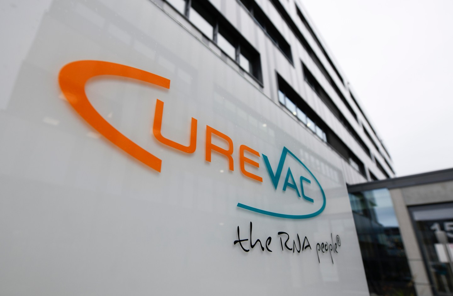The logo of the biopharmaceutical company CureVac, is displayed in front of the company's headquarters in Tuebingen, southern Germany on December 15, 2020.