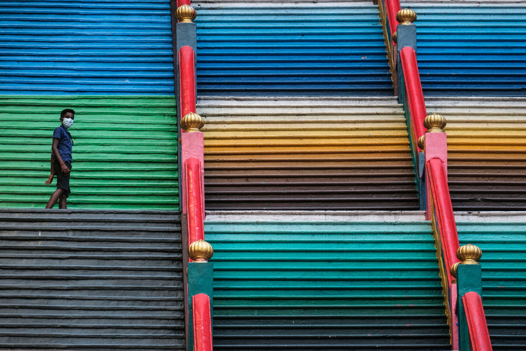 A boy wearing a face mask seen on the colourful 272-step