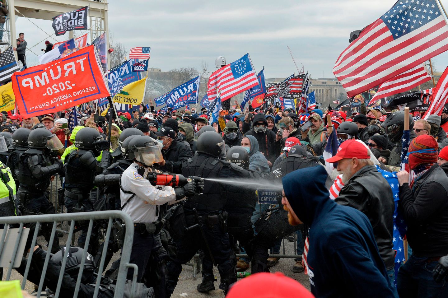 Trump supporters clash with police and security forces as they try to storm the US Capitol in Washington, DC on January 6, 2021. - Demonstrators breeched security and entered the Capitol as Congress debated the a 2020 presidential election Electoral Vote Certification.