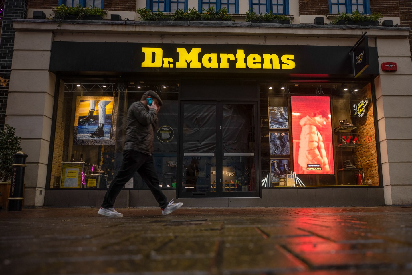 A pedestrians walks past the Dr. Martens store on Carnaby Street in London, U.K., on Wednesday, Jan. 20, 2021.