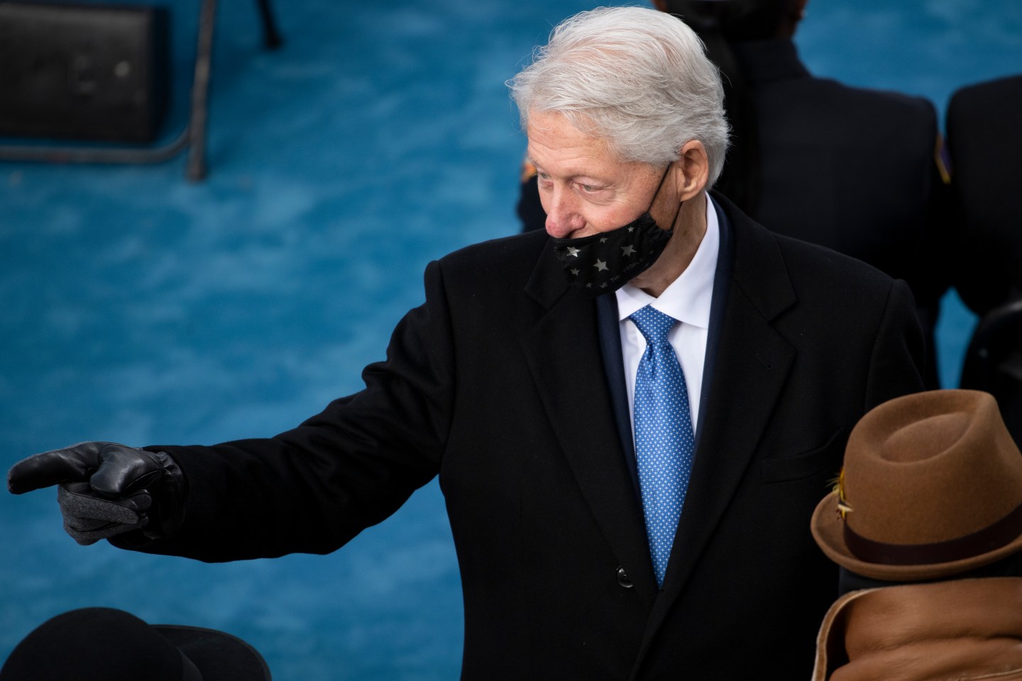 President Bill Clinton's mask slips below his nose at President Joe Biden's inauguration.