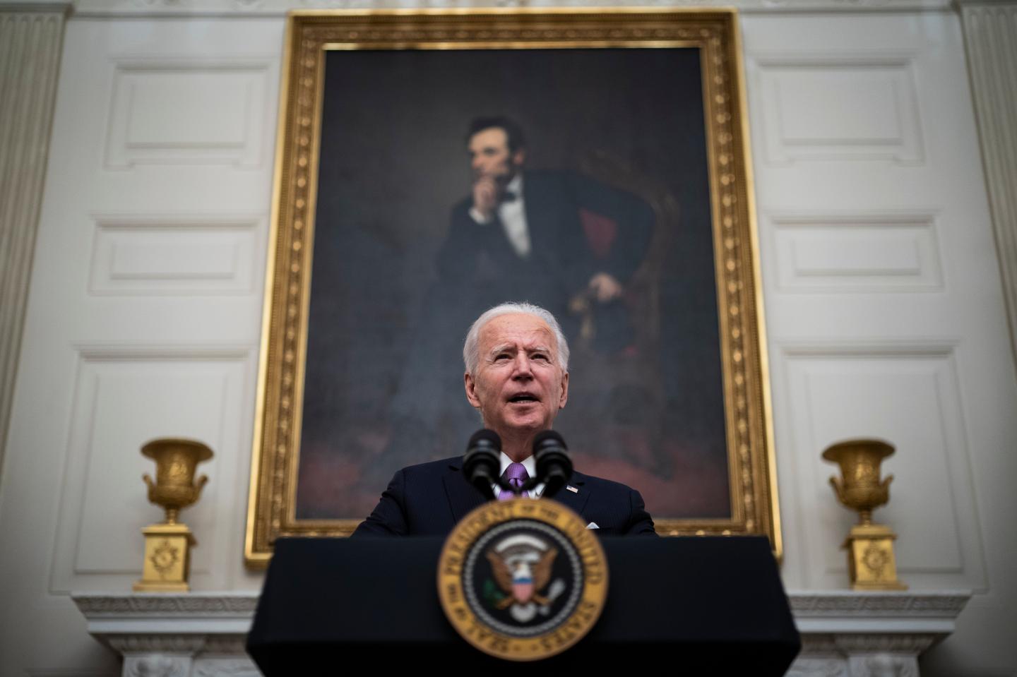 President Joe R. Biden, with Vice President Kamala Harris by his side, speaks about the COVID-19 coronavirus pandemic before signing executive orders in the State Dining Room at the White House on Thursday, Jan 21, 2021 in Washington, DC.