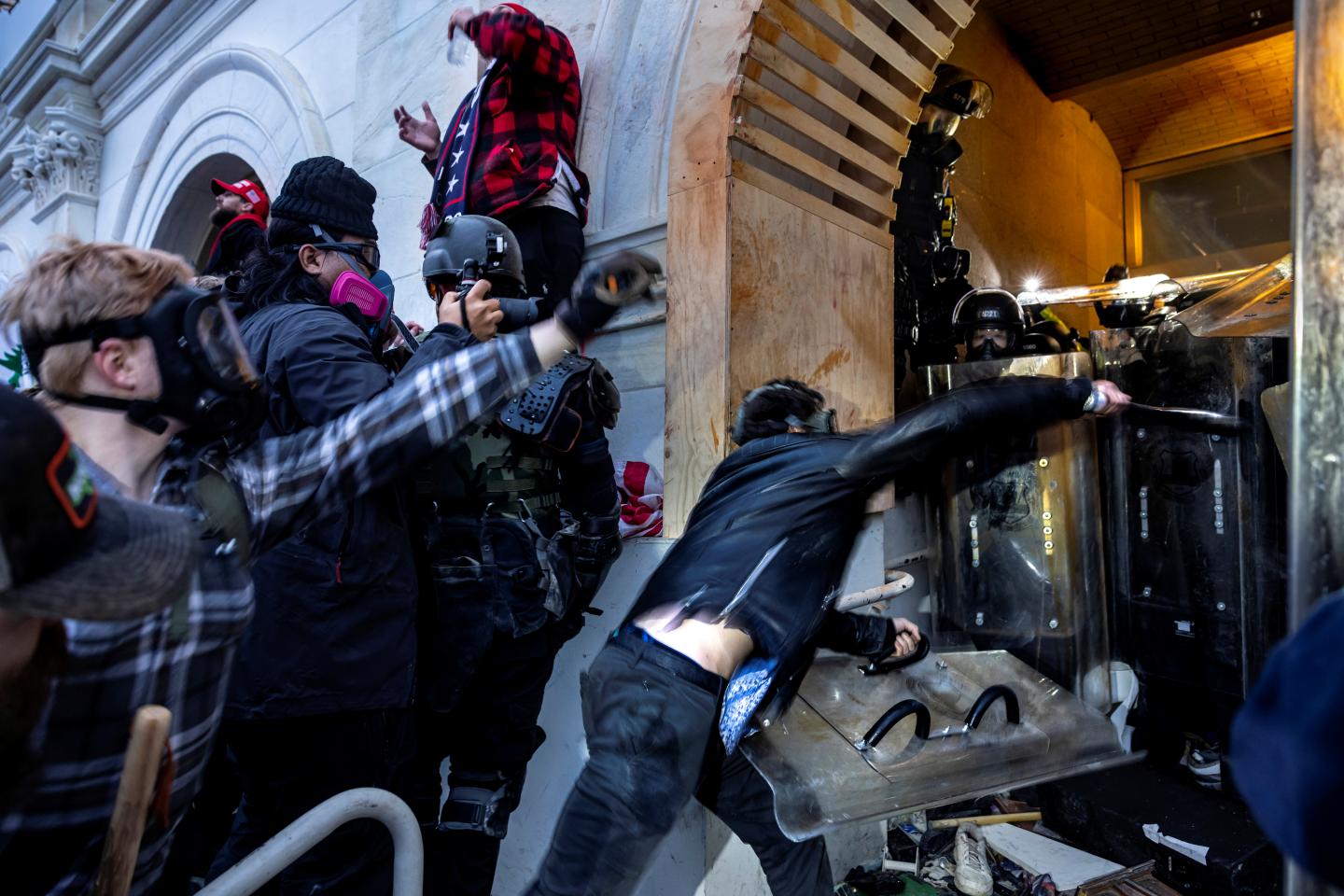 Trump supporters clash with police and security forces at the U.S. Capitol on Jan. 6, 2021. “In a nation swirling with misinformation and moral equivalence,” writes Leslie Dach, “the business community can be a voice for facts and truth.”
