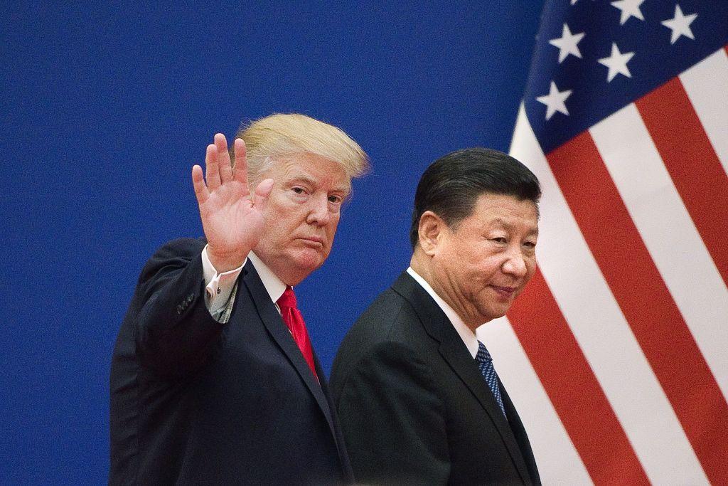 US President Donald Trump and China's President Xi Jinping leave a business leaders event at the Great Hall of the People in Beijing on November 9, 2017. 