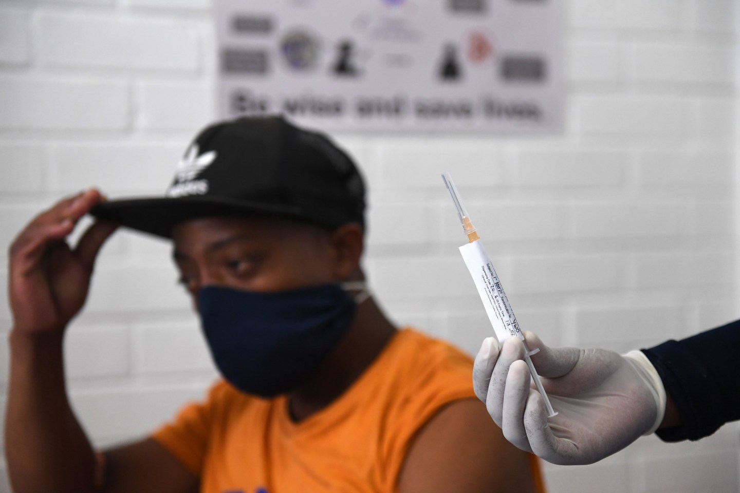 A volunteer receives an injection from a medical worker during the country's first human clinical trial for a potential vaccine against COVID-19 at the Baragwanath Hospital on June 28, 2020 in Soweto, South Africa.