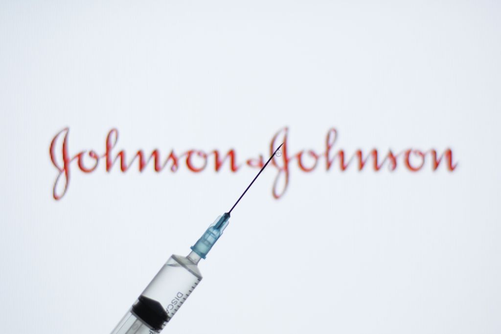 In this photo illustration a medical syringe seen displayed