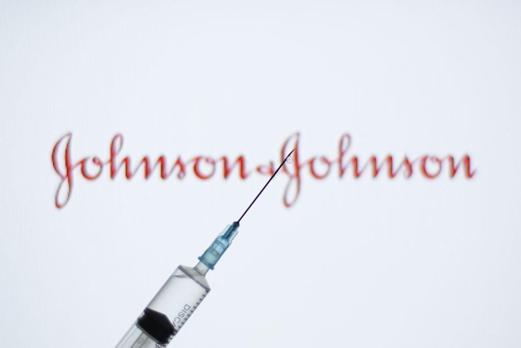 In this photo illustration a medical syringe seen displayed