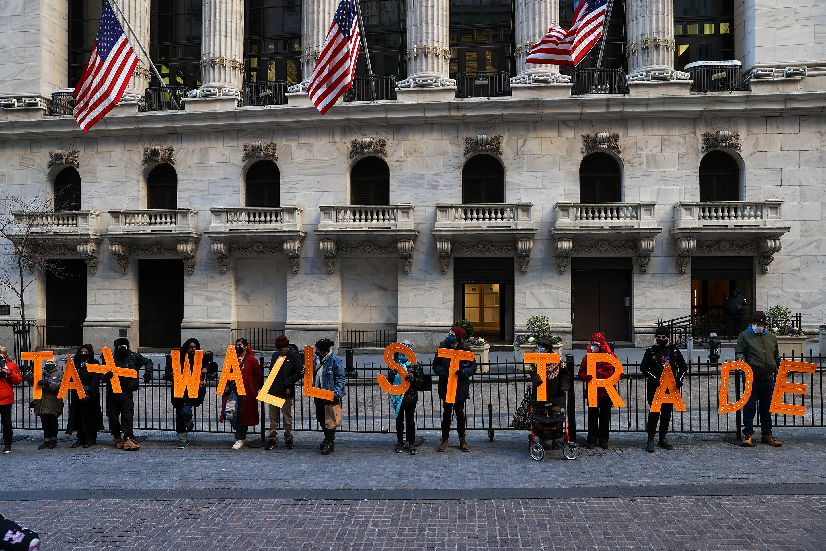 A group of demonstrators on Jan. 28, 2021, gathered by the New York Stock Exchange building to protest Robinhood and bring their voices to Wall Street trades amid GameStop stock chaos. 
