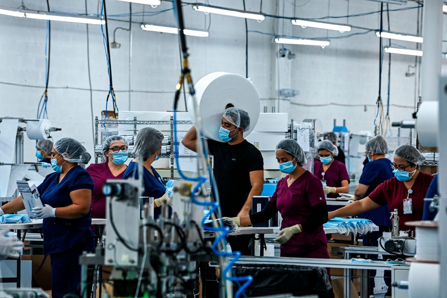 Employees at work in a medical equipment factory in North Miami, Fla. “When we look back on this pandemic,” the authors write, “history will ask how business leaders rethought their approach to employees and protected them.”