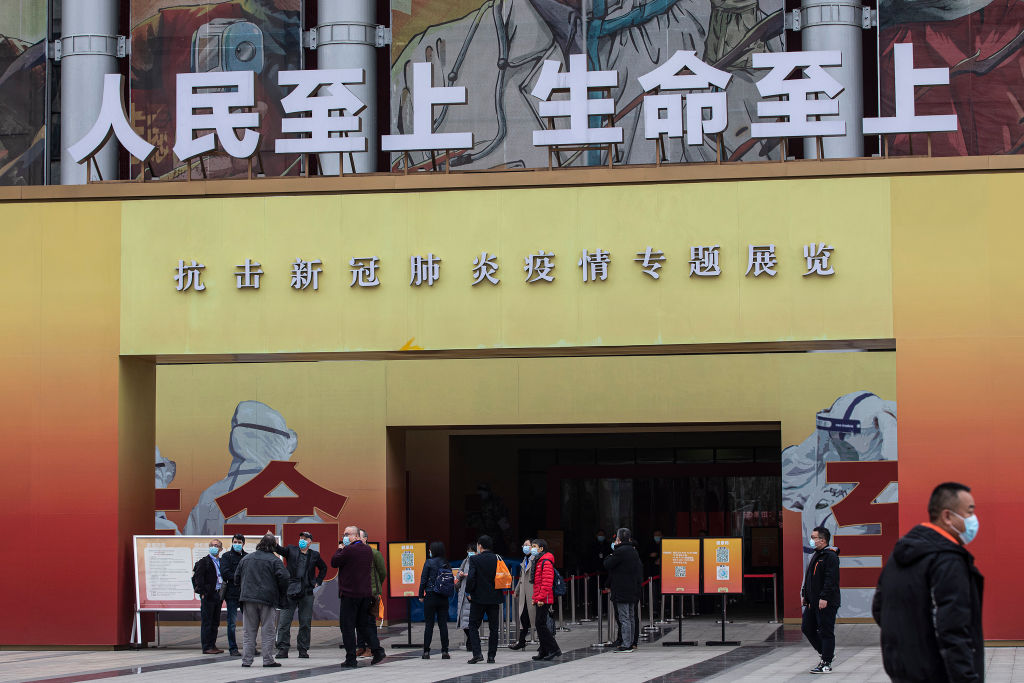 Members of a World Health Organization (WHO) delegation visit an exhibition on the city’s fight against the coronavirus on Jan. 30, 2021, in Wuhan, China.