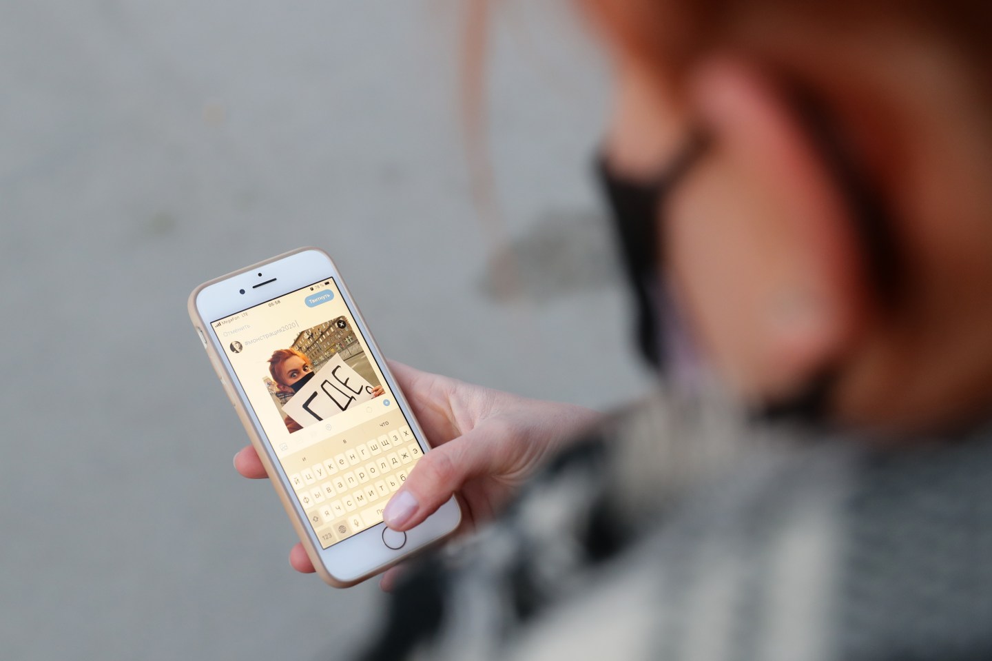 NOVOSIBIRSK, RUSSIA - MAY 1, 2020: A young girl posting her picture with a sign reading "Where Is Everyone?" on Twitter in a street. Artyom Loskutov, organizer of Monstration, an annual May Day youth performance art rally featuring comic slogans, urged to hold this year's event online on social media amid the COVID-19 coronavirus pandemic. The rally is held in Novosibirsk annually since 2004. Kirill Kukhmar/TASS (Photo by NOVOSIBIRSK, RUSSIA - MAY 1, 2020: A young girl posting her picture with a sign reading "Where Is Everyone?" on Twitter in a street. Artyom Loskutov, organizer of Monstration, an annual May Day youth performance art rally featuring comic slogans, urged to hold this year's event online on social media amid the COVID-19 coronavirus pandemic.