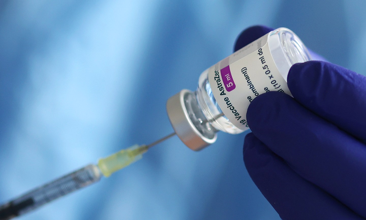 A doctor prepares a syringe with the AstraZeneca vaccine at the vaccination centre of the Saxony-Anhalt police medical service in Germany.