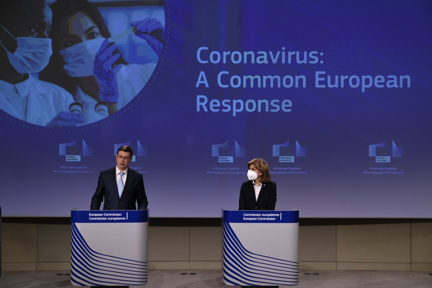 Valdis Dombrovskis, trade commissioner for the European Union, left, speaks beside Stella Kyriakides, health and food safety commissioner for the European Union, during a news conference in Brussels, Belgium, on Wednesday, March 24, 2021.