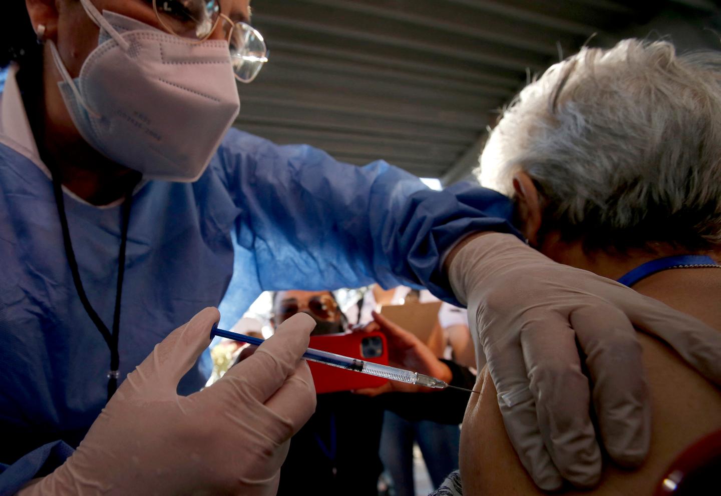 Someone being injected with the AstraZeneca vaccine.